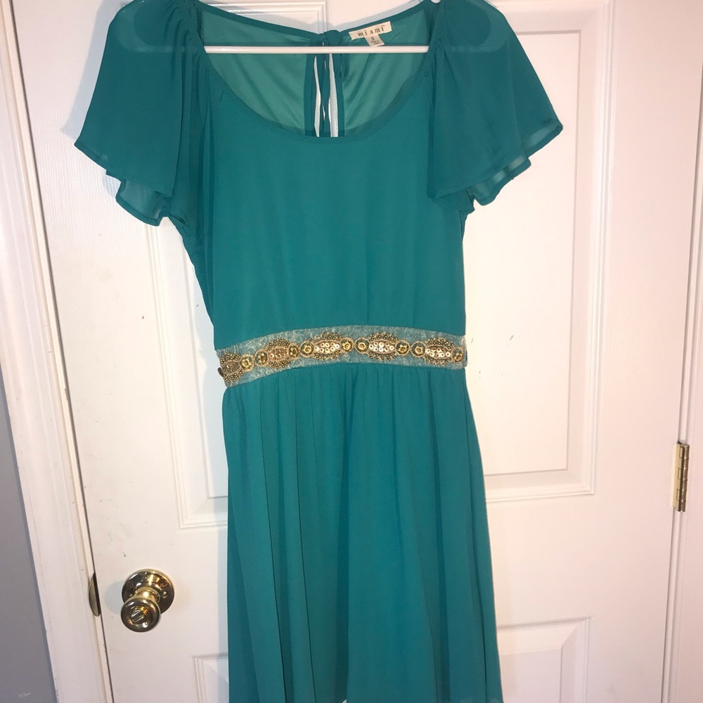 Turquoise dress with embellishments